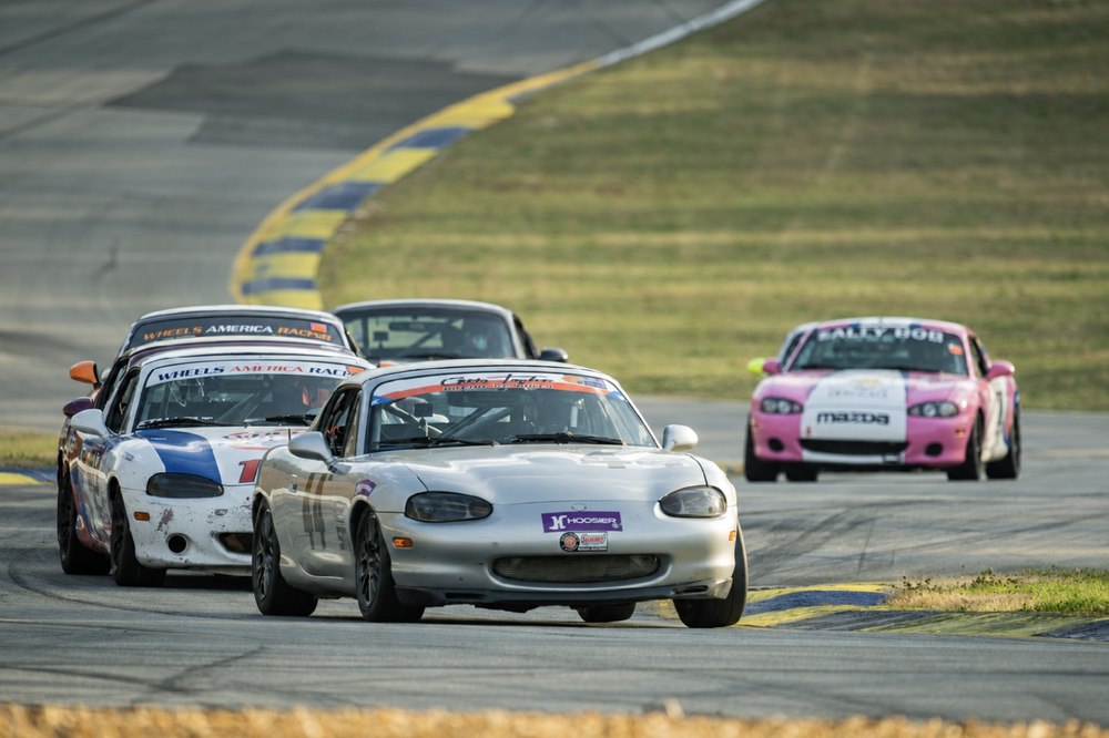 Ryan Kipke leading a pack of Spec Miatas through the esses at Road Atlanta